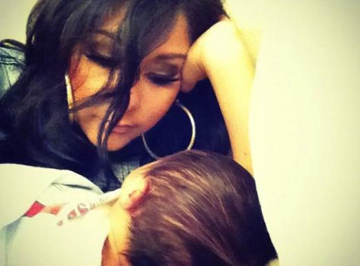 Snooki poses with baby son Lorenzo Dominic LaValle